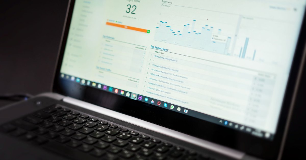 Marketer reviewing landing page conversion rates on a dashboard